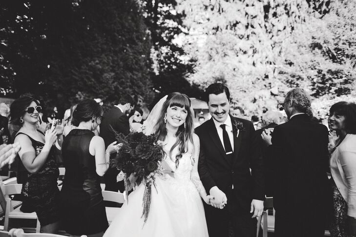 The joyful couple made their way up the aisle to a somewhat nontraditional tune: Fat Bottomed Girls by Queen. Everyone jumped up and started cheering, says Julia. It was a perfect moment.