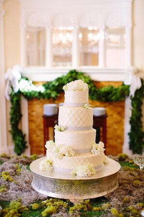 Four-Tier Buttercream Cake with Rhinestone Ribbon and Ivory Ranuncluses