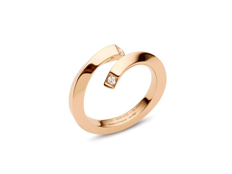 twisted rose gold ring with small diamonds on either end