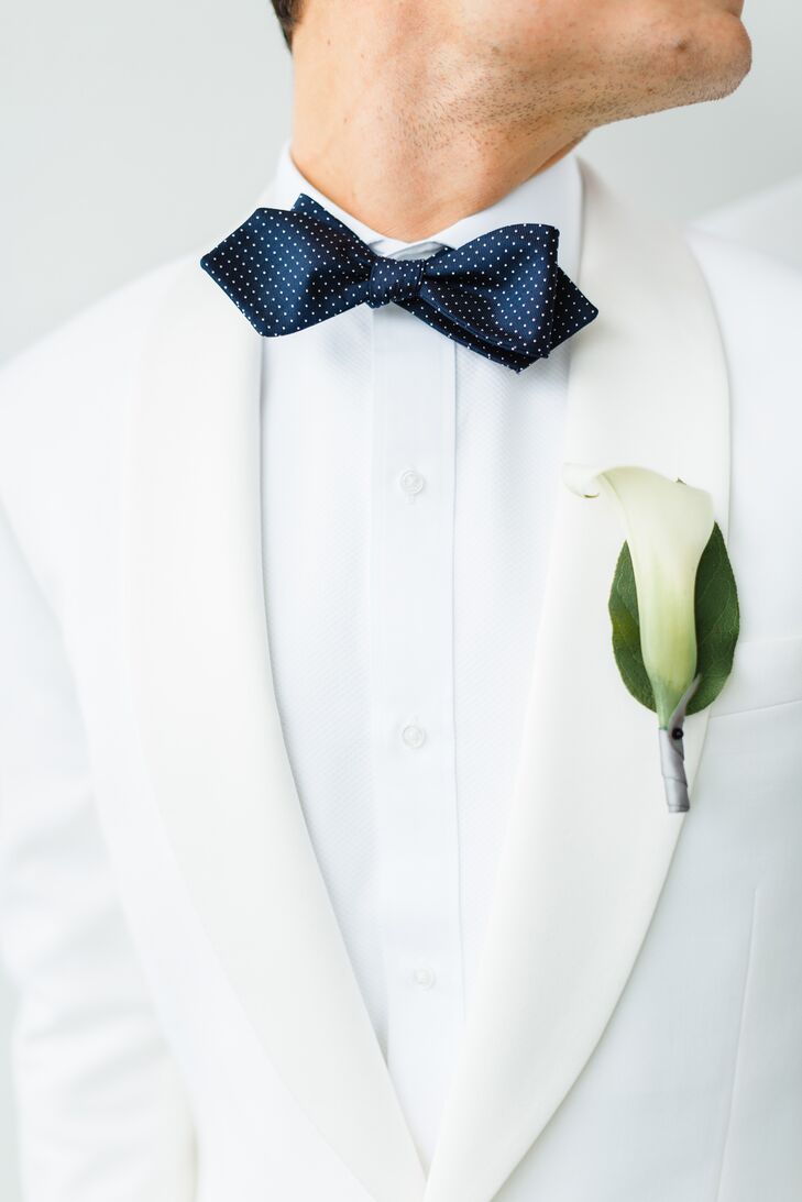 "We wanted all florals to be simple, sleek and somewhat masculine," Wes says. "All flower arrangements and the grooms’ boutonnieres were white calla lilies."