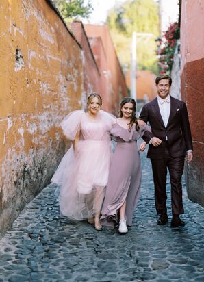 Bride in Pink Tulle Gown, Her Daughter in a Lavender Dress and Groom in Dark Maroon Suit