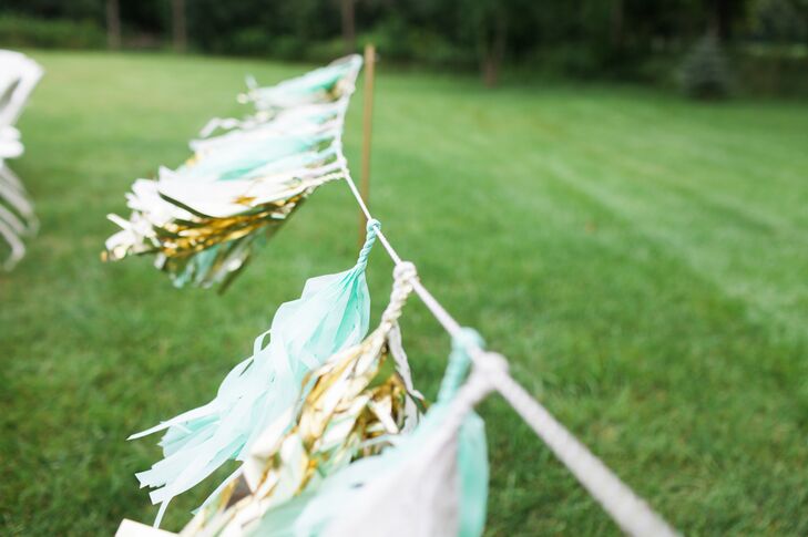 Turquoise and metallic gold tassels added a touch of DIY flair to the couple's outdoor ceremony.