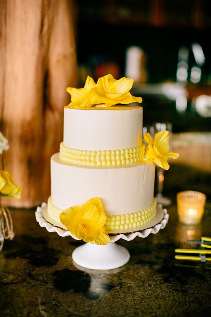 A few gladiolus and yellow fondant beads accented the simple two-tier buttercream cake. "I went with fresh flowers because I loved the element of realness they added," Charita says.