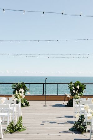 Modern Beach Ceremony Site with Monstera Leaves