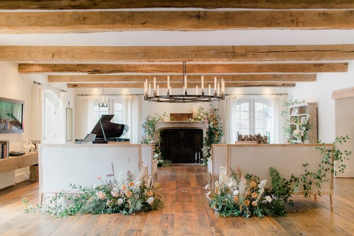 Ceremony Venue with Upholstered Furniture and Exposed Wood Beams