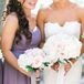 Bree and her bridesmaids carried polished, tightly bundled rose bouquets tied with silk and tulle ribbon.