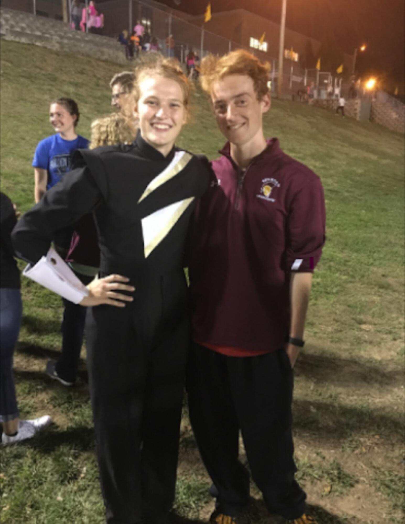 Our first picture together! After meeting at youth group and becoming friends, Owen came out to see Cassandra perform in the marching band. 