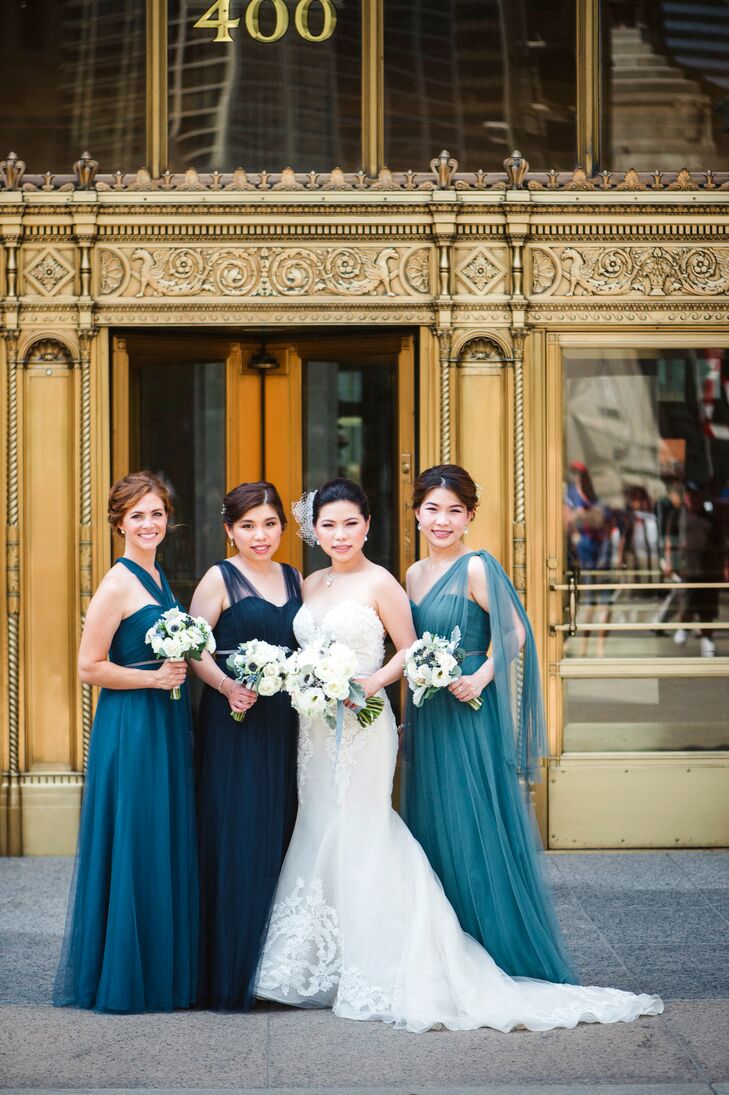 With two bridesmaids living outside the country, coordinating dress efforts was a little difficult. Lydia bought and shipped her sisters' five dresses in different styles, materials, colors and sizes. They chose a convertible style, Annabelle, by Jenny Yoo. Once she had locked in a dress designer, Lydia picked the three “loveliest shades of blue” and asked her bridesmaids to choose from those shades, then purchased matching belts for all three to unify the look.