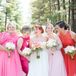 Meredith let her bridesmaids wear their own dresses in shades of pink, with gold accessories to add a touch of glam to their style.