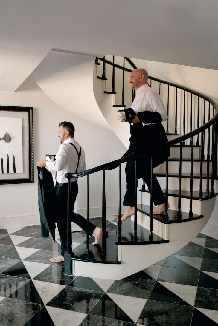 Grooms in Tuxes Walking Down Stairs While Getting Ready for Texas Wedding