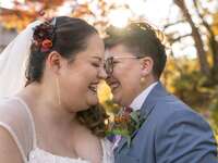 Couple laughs at a funny marriage quote. 