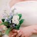 A Bride's Simple, Self-Created Bouquet With Blue-and-White Flowers