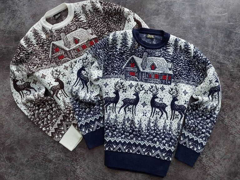 Snowy scene matching couples Christmas sweaters