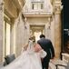 Groom With Blue Checkered Suit and Bride With Long Cape Walking Away