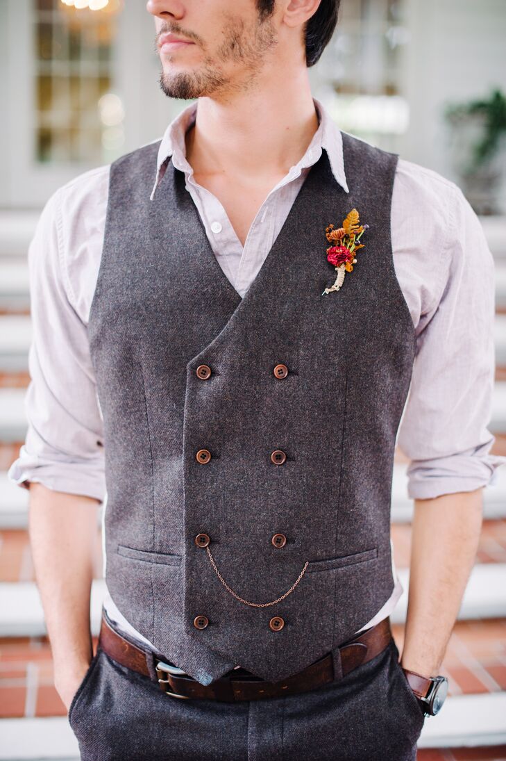 Zack took on a slightly more formal look than his groomsmen. He was ready for fall in a dapper, tweed double-breasted vest and matching pants by River Island. “We added a dark brown pocket chain to his vest. It gave us a matching look: his chain and my draping chains on my belt,” Shelby says. The addition also resembled a pocket watch chain, giving his look a more vintage vibe.
