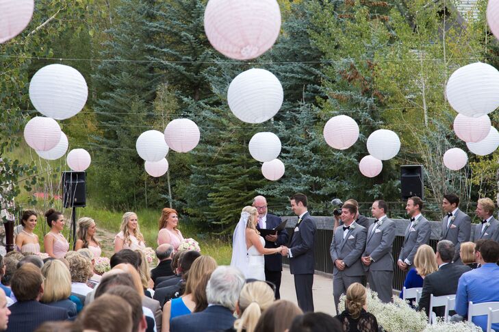 “The Knot Wedding Store had a big sale on lanterns, so we ordered light pink and white lanterns to string and hang above the rows where the guests sat on the ski bridge for the ceremony,” Ashley says.