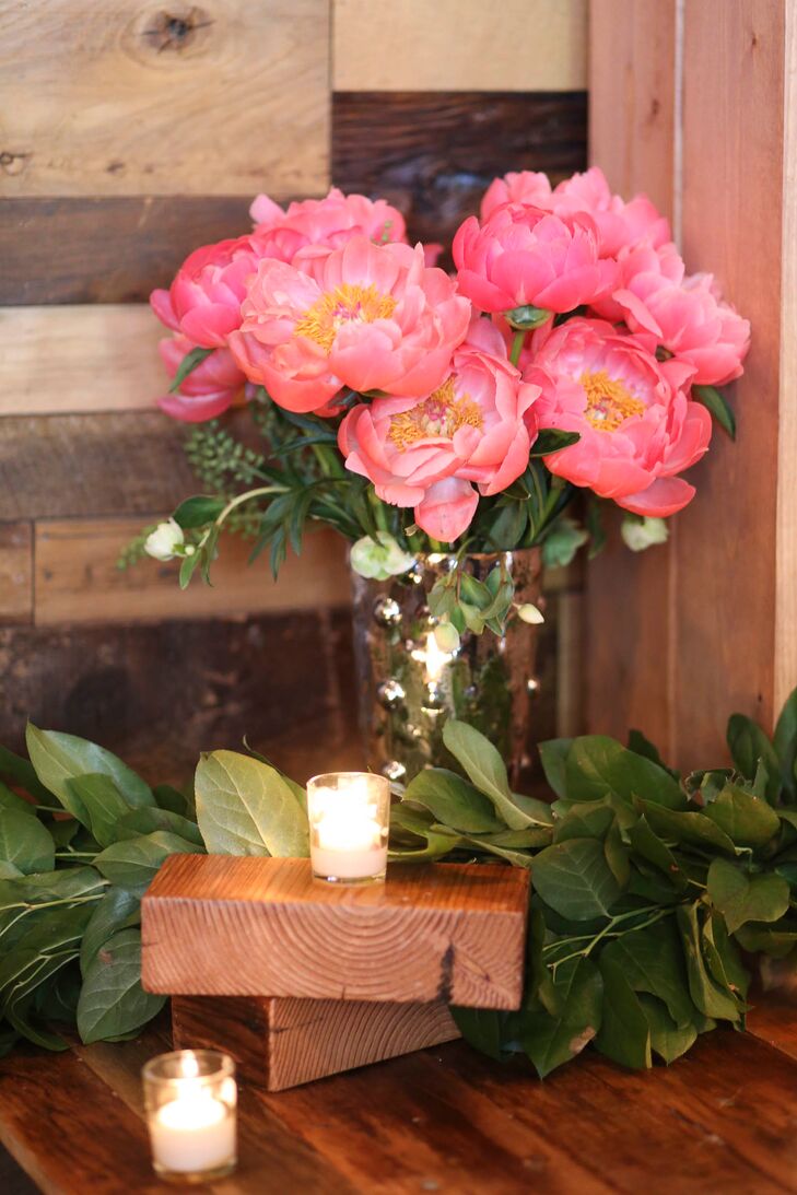 From the reception tables to Brooklyn Winery’s zinc-topped bar, arrangements of peonies, roses and wildflowers in brilliant shades of pink, coral rose and cream were incorporated throughout to add a pop of color to the venue’s cool rustic event spaces.