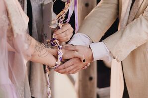 Couple Participating in a Wedding Hand Fasting Ceremony