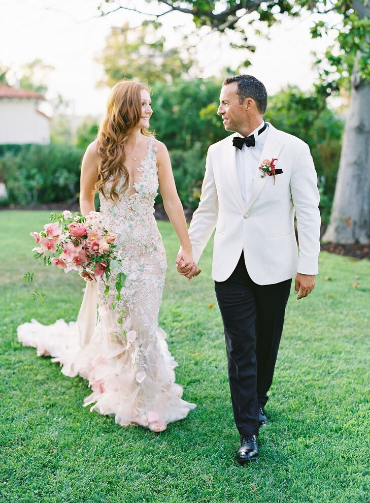 Bride and Groom Holding Hands and Walking at The Inn at Rancho Santa Fe in California