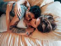 Couple laying in bed together