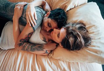 Couple laying in bed together
