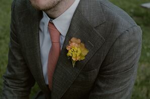 Groom in Gray Suit With Yellow, Coral, Leaf Boutonniere