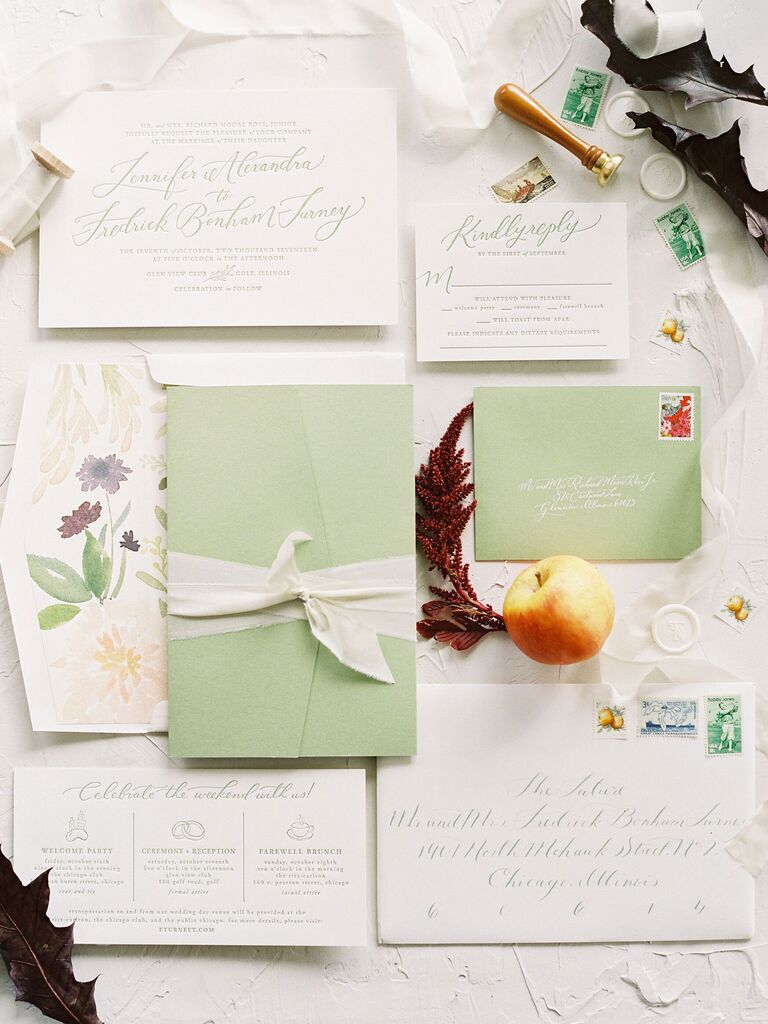 Green and white wedding invitation suite with stamped envelopes