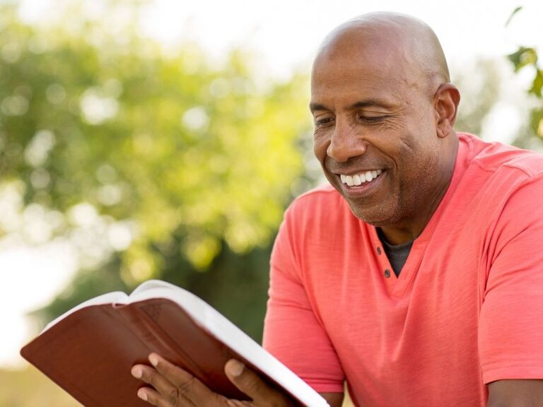 Man reading Bible verses about marriage