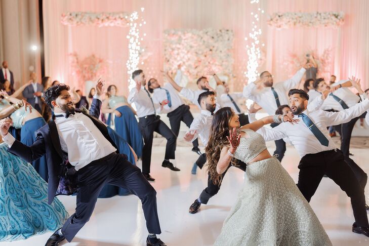 Bride in Lehenga, Groom in Tuxedo and Bridal Party Members Do Choreographed Reception Dance