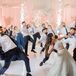 Bride in Lehenga, Groom in Tuxedo and Bridal Party Members Do Choreographed Reception Dance