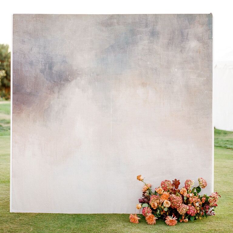 Minimal gray backdrop with floral accent