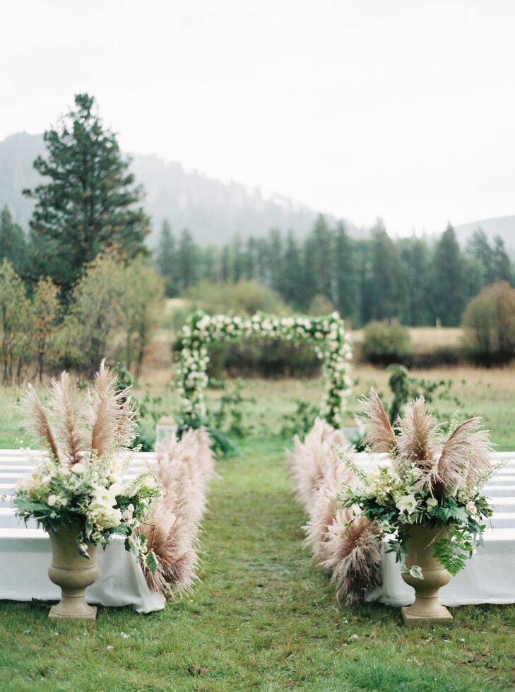 One unique element of the ceremony decor was the tall wheat-colored pampas grass lining the aisle. The wedding planner had the grass flown in for the wedding. The tufted grass looked almost like ostrich feathers, creating a romantic, stylish, bohemian aesthetic.