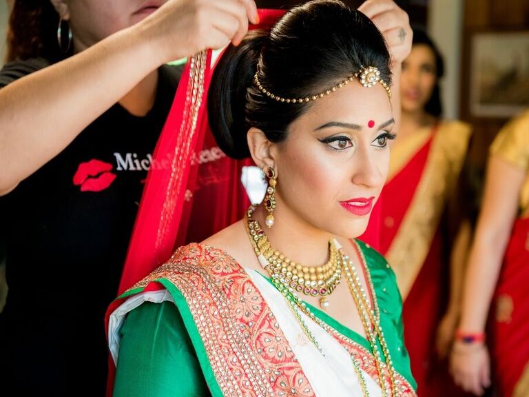 Bride gets her hair and makeup done by Michele Renee The Studio. 