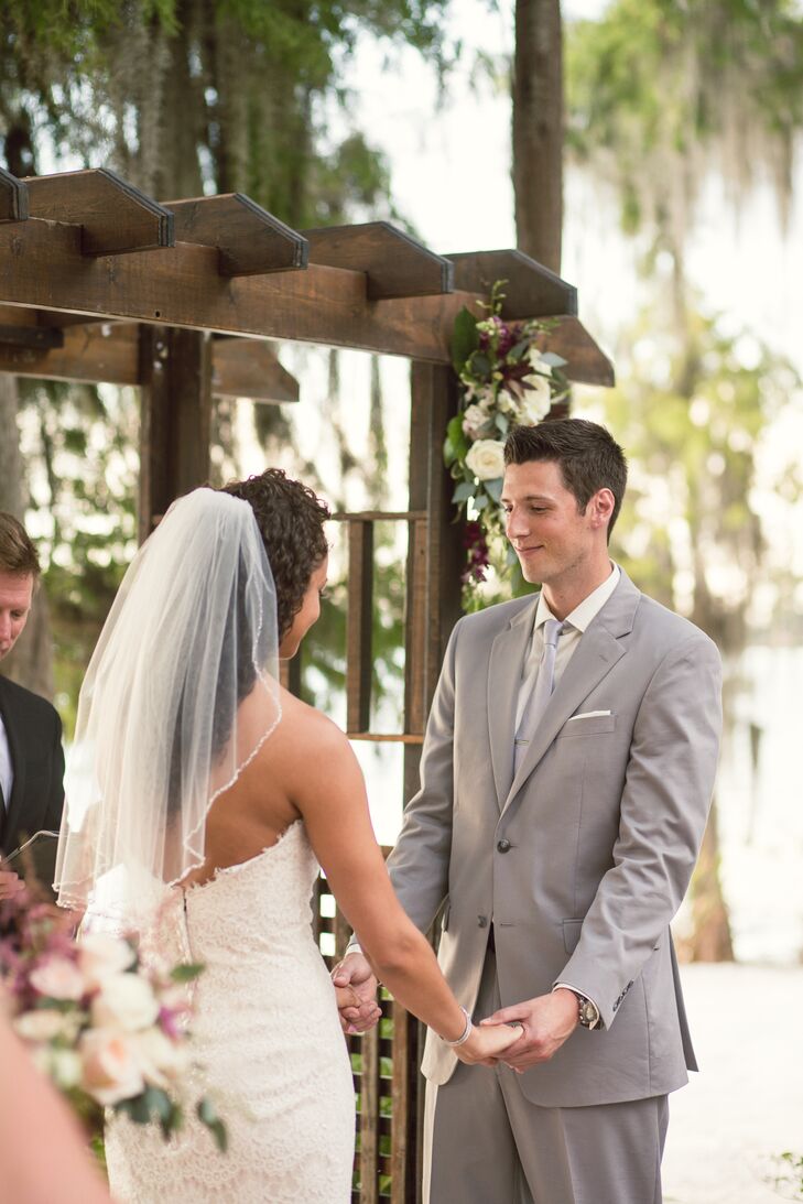 With delicate, ivory detailing throughout her dress, Jami wanted only a few accessories. She picked out this short, ivory veil trimmed with delicate beading and Swarovski crystals. It rested perfectly along her down curled hairstyle and enhanced her classic look.