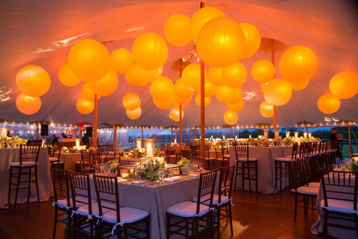 Japanese lanterns covered the ceiling of the tent while hundreds of white candles filled the rest of the space with a soft glow.