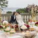 Mothers of the Bride and Groom Performing Cord Ceremony Over Couple