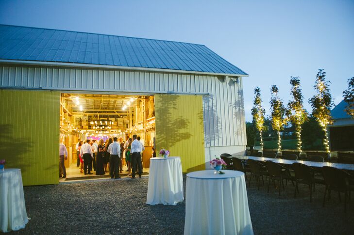 The cocktail hour and reception took place inside and around the barn at Jorgensen Farms, where guests gathered inside the brightly lit space for a fun evening.