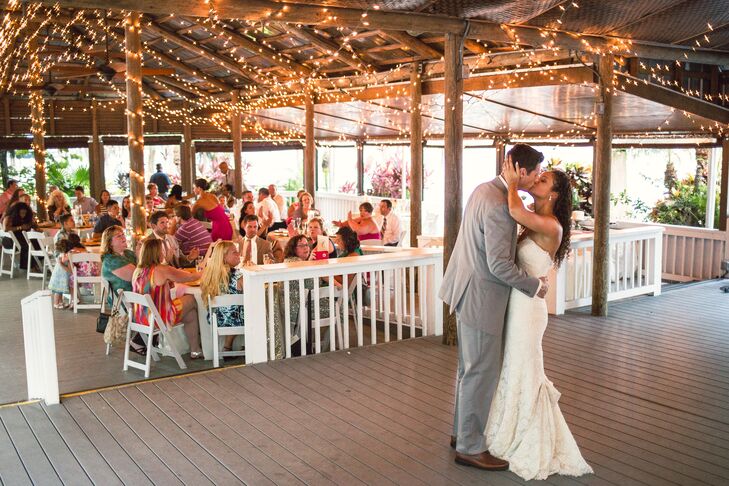 “Once I tried the dress on and saw the beautiful eyelash lace detail around the sweetheart neckline, I was sold,” Jami says. The romantic, ivory lace was her favorite part of the Allure look and covered every inch of the champagne underlay. Carrying a vintage-inspired style, the chapel-length, ivory train even wrapped into a perfect bustle as Jami and Chad danced around the reception at Paradise Cove in Orlando, Florida.