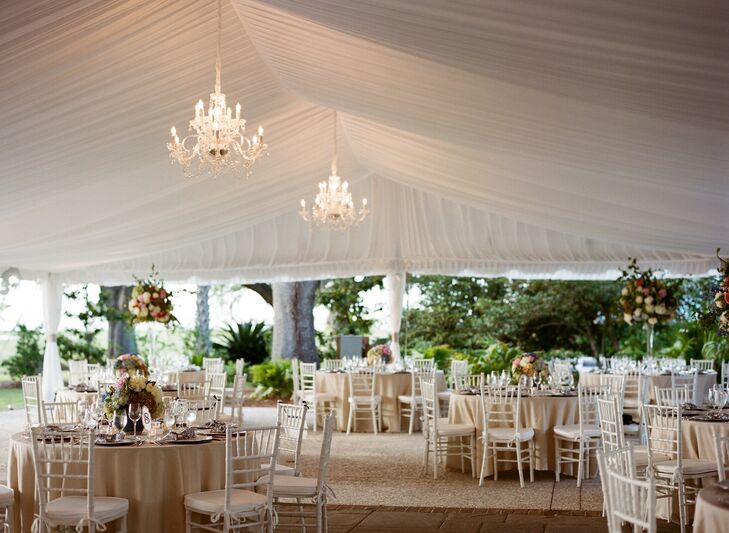 Airy linens and elegant chandeliers added a regal, romantic edge to the reception space.