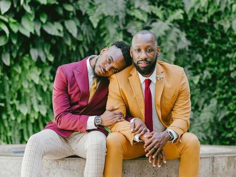 formal engagement photo with couple in suits