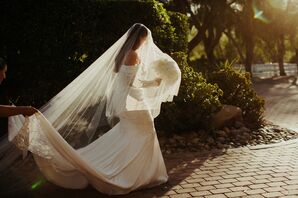 Bride With White Bouquet at Golden Hour Covered in Long Veil, Dress Train