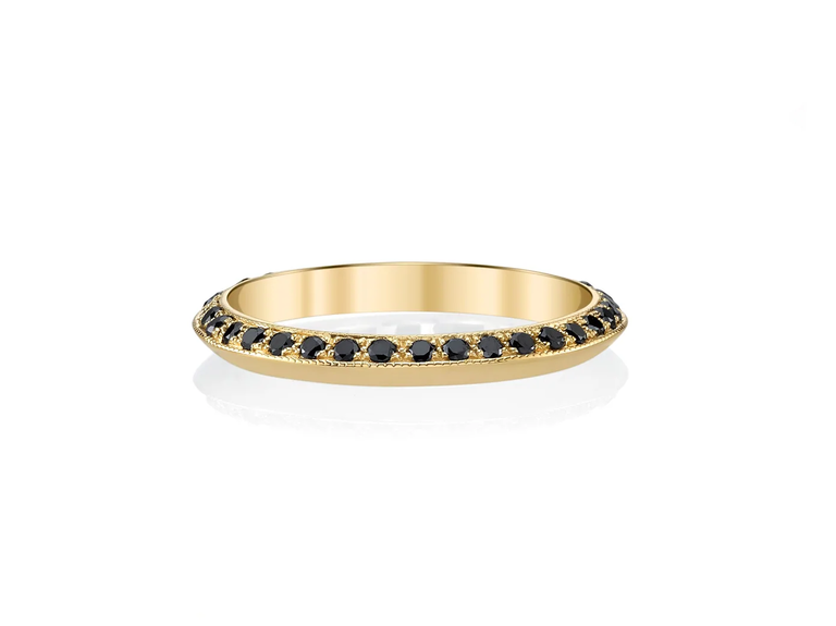 Nothing is quite so elegant as this gold engagement ring set with a collection of dainty black diamonds.