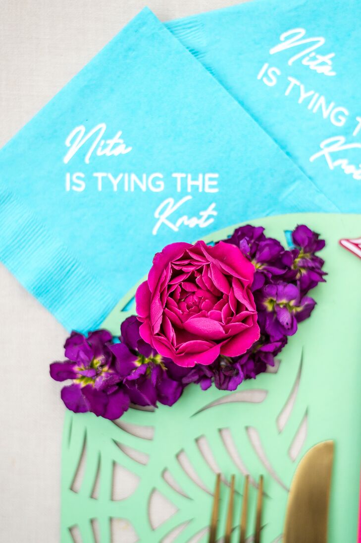 Personalized Blue Napkins And Bright Flowers on Turquoise Mat for Bridal Shower