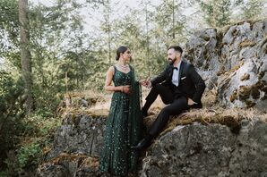 Bride in Emerald Green Lengha Dress and Groom in Classic Tuxedo Holding Hands Before Their Sikh Reception
