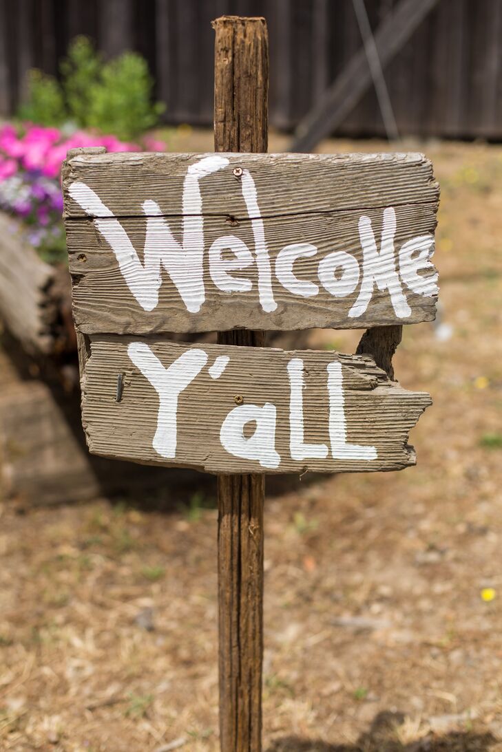 Hand-painted wood signs, made by Allyson from wood sourced from the property, were scattered throughout the property, greeting guests, point them in the right direction and adding a rustic note to the wedding's decor.