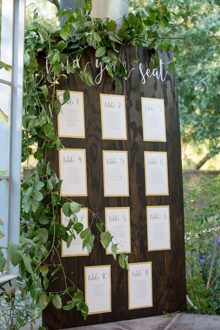 In keeping with the natural vibe at the Springs Preserve in Las Vegas, Nevada, after the ceremony guests found their names on lists posted to a large wooden board. "I made a large wooden board and stained it a darker color to match the wooden sign with our names on it," Jenna says. "It had at the top 'Find your seat' written in calligraphy as well."