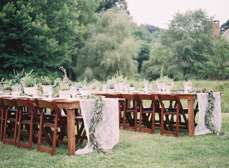 Rustic wood tables with lace runners topped with wooden flower boxes decorated the outdoor reception.  "I wanted simple, rustic and southern wedding and decided not to have a planner!" says Samantha.