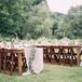 Rustic wood tables with lace runners topped with wooden flower boxes decorated the outdoor reception.  "I wanted simple, rustic and southern wedding and decided not to have a planner!" says Samantha.