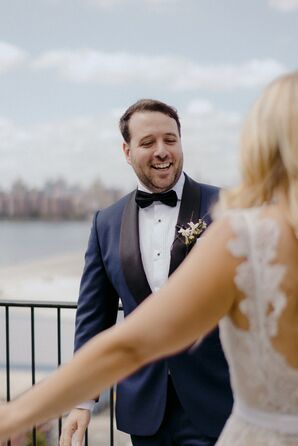 Groom in Navy Tuxedo Seeing Bride for the First Time During First Look, Cityscape
