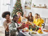 Friends taking selfie at Christmas party